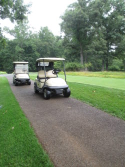Two golf carts parked on a Porous Pave cart path